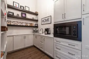 Modern kitchen with a microwave oven and white cabinets