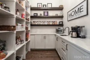 Kitchen with a home wall frame and items on shelves