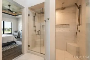 Bedroom with attached bathroom with glass door