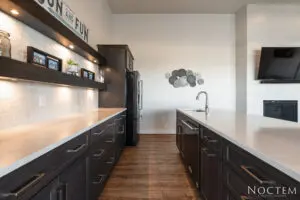 Modern kitchen with black cabinet and a sink