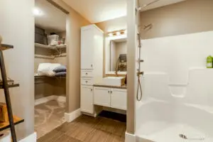 Bathroom with shower and cabinet with mirror out side