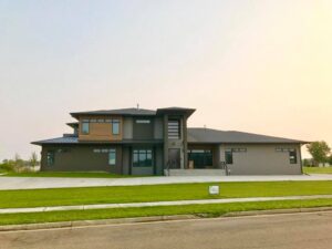 A large house with a lot of windows and doors.