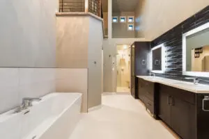 A bathroom with a large tub and walk in shower.