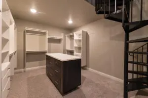 A room with a large closet and a counter.