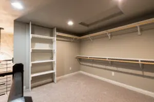 A room with shelves and a ladder in it