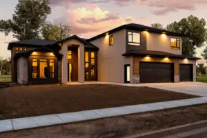 A large modern home with a driveway and garage.