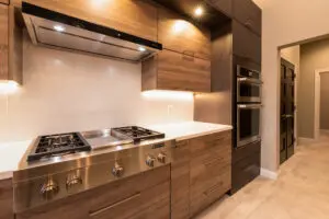 A kitchen with wooden cabinets and stainless steel appliances.