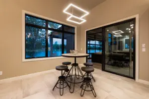 A dining room with a table and chairs in it