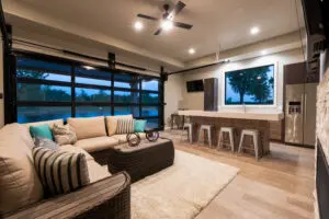 A living room with a couch, table and television.