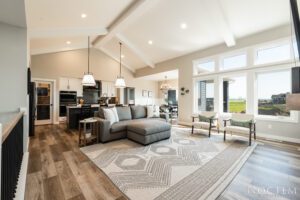 Modern living room with sectional sofa and rug.