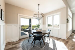 Dining room with a view and chandelier.