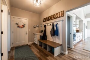 Entryway with coat rack and bench.